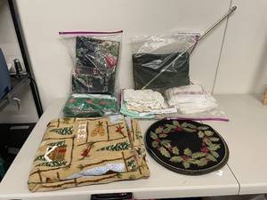 lot 44K image: Mixed Lot Linens, Tablecloths, Holiday Decor, and Scandinavian Wall Hanging