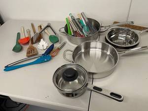 lot 52K image: Comprehensive Kitchen Cookware Set with Calphalon Pots and Assorted Utensils