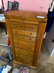 lot 85 image: Tall Oak Wood Jewelry Armoire with Large Assortment of Costume Jewelry and Watches
