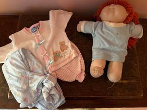 lot 132 image: Cabbage Patch Kids Doll with Red Yarn Hair and 2 Extra Outfits