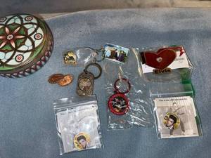 lot 167 image: Elvis Presley Collectible Keychains, Pins, Pressed Pennies, and Decorative Tin