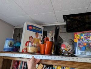 lot 216 image: Vintage Gilbert Microscope Set, Balloon Festival Puzzle, Collectible Mardi Gras Coins, and Desk Accessories Collection