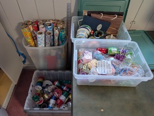 lot 243 image: Large Collection of Gift Wrapping Paper, Ribbons, and Gift Bags