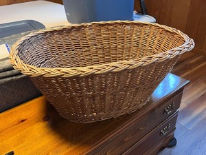 lot 187 image: Large Oval Wicker Basket with Woven Design, wood and plastic hangers included