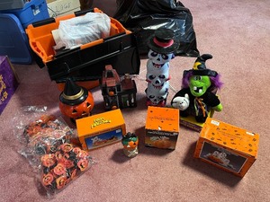 lot 254 image: Large Halloween Decor Collection with Animated Witch, Lights, Porcelain Pieces, and Storage Tote