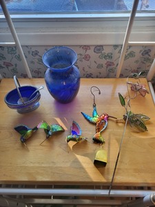 lot 17 image: Collection of Blue Glass Vase, Silver Basket, and 4 Enamel Hummingbird Figurines