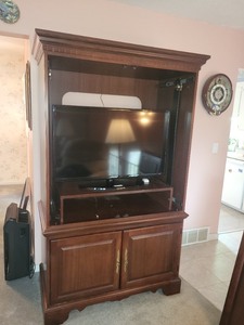 lot 48 image: Large Wooden Entertainment Center with Brass Handles
