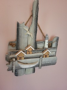 lot 58 image: Rustic Coastal Wall Art with Lighthouse and Boat
