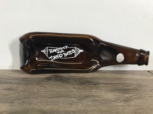 lot 275 image: Quirky Flattened Beer Bottle Ashtray by Houze Art Hammock for Tired Butts