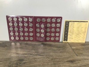 lot 304 image: Book of United States National Site Commemorative Quarters Set of 56  - Deerwood Bank - 2010-2021