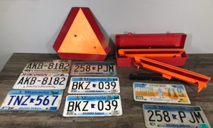 lot 144 image: Orange Metal Triangle Caution Sign, Several License Plates and Triangle Reflector Kit