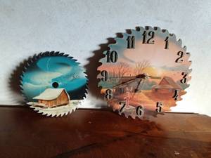 lot 40 image: A signed hand-painted saw blade by M. Cadlen 2002 and a hand-painted scenery wood cut out saw blade clock