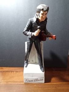 lot 59 image: 1977 McCormick musical porcelain Elvis Presley liquor decanter