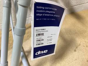 lot 408 image: Drive Medical 11148-1 Folding Steel Bedside Commode Chair