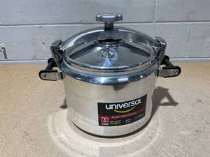 lot 18 image: Universal (Large) 15-Quart Aluminum Pressure Cooker for Professional Use  Commercial-Grade, 1 Safety Valve, Reinforced Handles, Easy-Open Lid,  Ideal for Large Kitchens, and Restaurants
