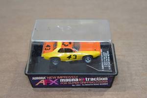 lot 84 image: Vintage Aurora Plymouth Road Runner HO Scale Slot Car