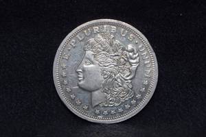 lot 99 image: One Troy Ounce Silver Coin - Morgan
