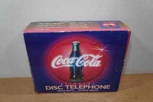 lot 208 image: Coca-Cola Blinking Disc Telephone