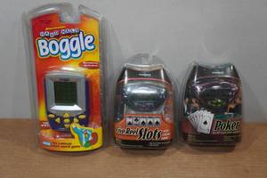 lot 310 image: Hand Held Electronic Games- Poker, Slots, Boggle