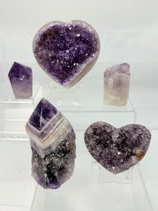 lot 6 image: Amethyst lot including a 297 gm10.4 oz. heart, a 131 gm4.6 oz. heart, 296 gm10.4 oz. rough Chevron tower, 125 gm4.4 oz amethyst core and a 61 gm2.2 oz polished point