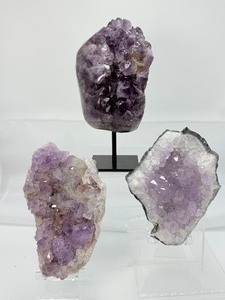 lot 16 image: Amethyst Lot of 3-large geode on custom metal stand 1.5 kilo3 lbs 4 oz., large geode plate 699 gm.1 lb. 9 oz. and a large geode plate 494 gm.1lb. 1 oz.