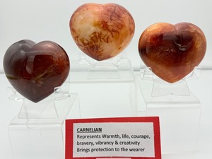 lot 70 image: Carnelian Lot of 3 polished hearts large puffy heart 263 gm.9.3 oz., darker heart 158 gm.4.2 oz., heart 149 gm.5.3 oz.