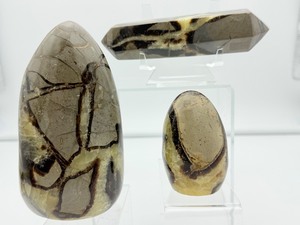 lot 38 image: Septarian Polished Lot of 3 Large Freeform 841 gm.1 lb. 14 oz, small freeform 197 gm.7 oz., large double terminated generator wand 323 gm.11 oz.