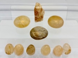 lot 224 image: Golden Healer Polished and Rough Misc. Lot of 10 3 palmstones, 6 small eggs, and 1 rough chunk Total Log Weight 323 gm.11.4 oz.