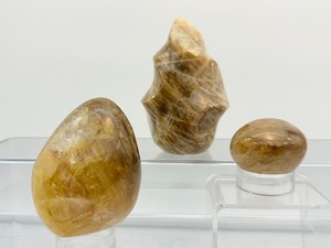 lot 52 image: Golden Healer (yellow hematoid quartz) 3-piece lot flame 401 gm.14.1 oz., freeform 317 gm.11.2 oz. and palmstone 96 gm.3.4 oz.