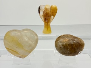 lot 207 image: Golden Healer polished misc. lot of 3 heart 190 gm.6.7 oz., gallet 114 gm.4 oz., angel 87 gm.3 oz. Total Lot Weight 393 gm.13.8 oz.