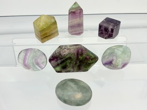 lot 208 image: Fluorite Polished Misc. Lot of 7 Rainbow geometric palmstone 55 gm.1.9 oz., green palmstone 44 gm.1.6 oz., small rainbow tower 42 gm.1.5 oz., 2 rainbow palmstones 47 gm.1.7 oz., small rainbow tower 27 gm.1 oz., and cube 26 gm.1.7 oz.
