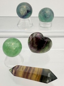 lot 225 image: Fluorite Misc. Lot of 5 rainbow heart 62 gm.2.2 oz., rainbow double terminated wand 335 gm.1.2 oz., two rainbow spheres 30mm 51 gm.3.4 oz., one green sphere 30mm 44 gm. 1.6 oz.