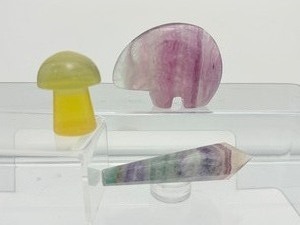 lot 256 image: Fluorite Polished Misc. Lot of 3 rainbow Zuni bear 150gm5.3oz., rainbow wand 62gm.2.2oz, yellow mushroom 59gm2.1oz.