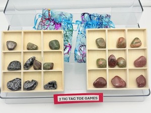 lot 99 image: 2 Tic Tac Toe games from balsa wood  one set with red jasper & unakite tumbles, the other snowflake obsidian & dragon stone tumbles