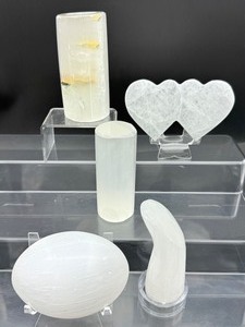 lot 87 image: Selenite misc. lot of 5 cylinder 284 gm. 10 oz., XL gallot 294 gm.10.4 oz., double heart 192 gm.6.8 oz., massage wand 182 gm.6.4 ox. and votive holder 389 gm.14 oz.
