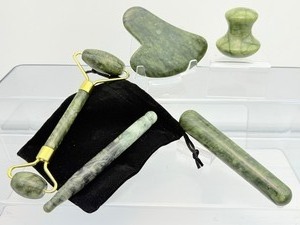 lot 94 image: 5 piece Jade Gua Sha set with Facial Roller & Massagers with velvet carrying bag