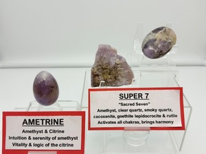 lot 89 image: Super 7 (Melody Stone) and Ametrine lot of 3 Super 7 polished fan shaped piece 42 gm.1.5 oz, Super 7 palmstone 59 gm.2.1 oz., and Ametrine egg 59 gm.2.1 oz