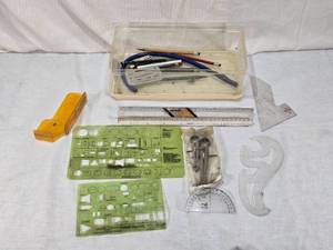 lot 24 image: Vintage Drafting Tools and Templates including Pickett Graphic Symbols No. 1279, Compass Set, Rulers, and French Curve