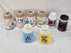 lot 29 image: Lot of Vintage Lunch Box Thermo Bottles Containers Including Care Bears, Mickey Mouse, and Smurfs