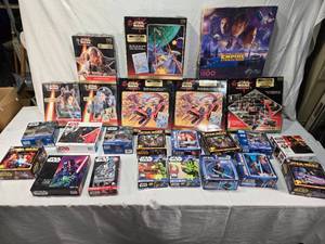 lot 73 image: Huge Lot of Star Wars Puzzles including The Empire Strikes Back 1500 Piece Puzzle, Episode I Podrace Challenge Puzzle, and Lenticular Puzzles - Uncounted