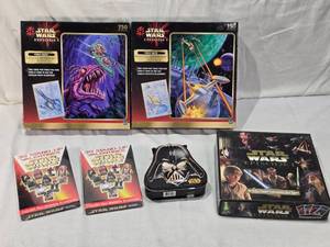 lot 74 image: Unopened Star Wars Puzzles and Game including Episode I Puzzles, Stand-Up Valentines, Darth Vader Tin, and Card Game