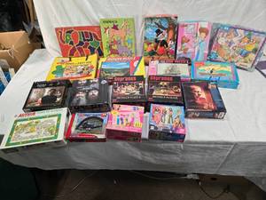 lot 92 image: Jigsaw Puzzles Including The Sopranos, Game of Thrones, and Disney Themes - Uncounted