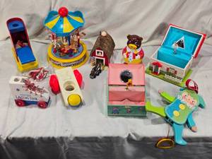 lot 103 image: Vintage toys including Carousel, Musical Boxes, and Lacing Shoes