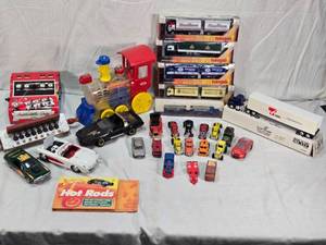 lot 121 image: Assorted Vintage and Toy Vehicles, Arithmetic Quiz, Small Foreign Beer Semis and Harmonicas