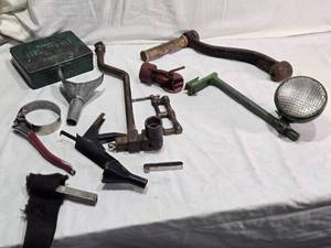 lot 143 image: Empty Automobile First Aid Kit No. 40, Vintage Tools, and Accessories Lot including Funnel, Crank, Light