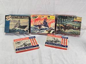 lot 165 image: Lot of 5 Guild and Fighters for Freedom Picture Puzzles, including Guild No. 3900 and Fighters for Freedom No. 3902 - One has some bent pieces, One is Complete, One is Missing a Single Piece