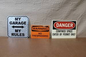 lot 62 image: Set of 3 Metal Signs Including Garage, Warning, and Danger Designs