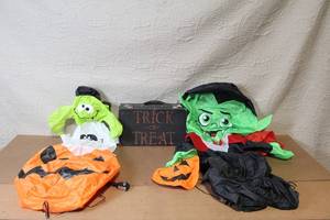 lot 77 image: Halloween Inflatable Witch and Vampire Decorations with Trick or Treat Case