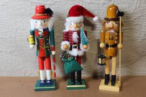 lot 122 image: Set of 3 Decorative Wooden Holiday Nutcrackers