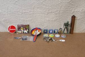 lot 149 image: Vintage Toy Collection with Studebaker Badge, Davy Crockett Wallet, and Handcuffs